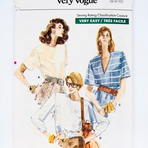 May include: A sewing pattern for three different tops. The pattern is called "Very Easy Very Vogue" and the pattern number is 7128. The pattern is for sizes 6-8-10. The sewing rating is "Very Easy/Très Facile".