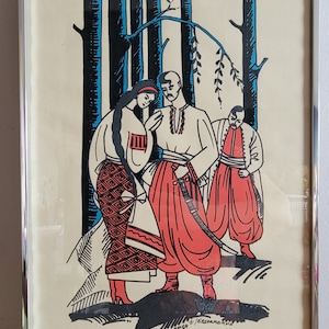 May include: Framed print featuring a stylized illustration of three figures in traditional clothing. The figures are depicted in red, white, and black against a backdrop of stylized trees. The print is in a silver frame.