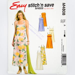 Könnte beinhalten: Ein McCall's Schnittmuster "Easy stitch'n save M4808" mit einer Frau in einem floralen Kleid. Das Muster enthält Illustrationen von Kleiderdesigns in Orange, Blau und Creme. Größe A (4-6-8).