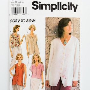 May include: A Simplicity sewing pattern with illustrations of women's tops and a white button-down shirt. The pattern includes sizes 6, 8, and 10. The text "easy to sew" is displayed. Measurements are in EUR and FR.