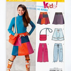 May include: A sewing pattern for kids' clothing, featuring a patchwork skirt, trousers, and a bag. The pattern is from Newlook and is size A 8-16. The pattern is for children's clothing and includes instructions for making a patchwork skirt, trousers, and a bag.
