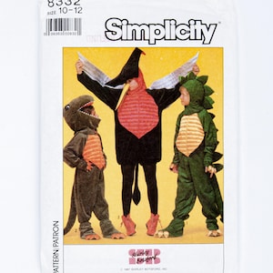 May include: Simplicity sewing pattern 8332, size 10-12, featuring illustrations of three dinosaur costumes. One costume is a black pterodactyl with silver wings, one is a brown dinosaur, and one is a green dinosaur with a spiked back and tail.