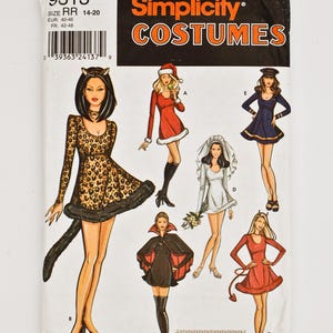 May include: A Simplicity Costumes sewing pattern with illustrations of Halloween and fancy dress outfits. Designs include a leopard print cat costume, a Santa dress, a bride, a sailor, a vampire, and a devil costume.