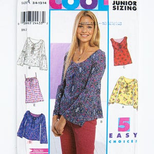 May include: A New Look sewing pattern with five easy choices for junior sizing. The pattern shows illustrations of tops in different styles and colours, including a paisley print blouse and a floral top. The word "COOL" is displayed at the top.