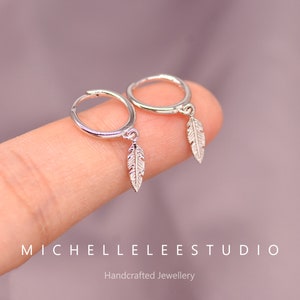 Sterling silver feather hoop earrings top