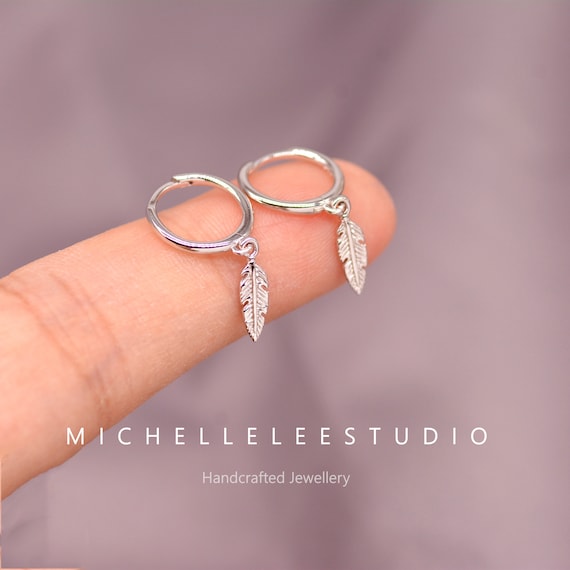 Small silver store feather earrings