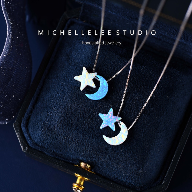 May include: Two silver necklaces with opal star and crescent moon pendants. The necklaces are displayed in a black velvet box with the text "MICHELLELEESTUDIO Handcrafted Jewellery".