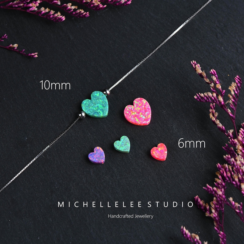 May include: A silver necklace with a 10mm green heart pendant and several smaller heart-shaped gemstones in shades of pink, green, and purple. The image includes the text "MICHELLELEE STUDIO Handcrafted Jewellery".