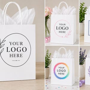 Puede incluir: Bolsas de regalo de papel blanco con asas, cada una con un diseño "YOUR LOGO HERE". Los diseños incluyen un círculo con hojas, una corona floral rosa, un cuadrado azul con hojas, un círculo arcoíris y un hexágono morado con hojas.