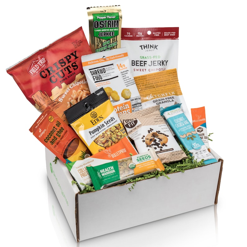 care package box with an assortment of high protein snacks a college guy will enjoy