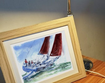 May include: A framed watercolor painting of a sailboat with red sails and three people on board. The boat is sailing on a blue and white sea with green waves. The painting is signed "M. Levine" in the bottom right corner.