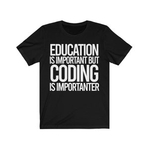 May include: Black t-shirt with white text that reads: "EDUCATION IS IMPORTANT BUT CODING IS IMPORTER." The shirt has short sleeves and a crew neck. The text is in a bold, sans-serif font.