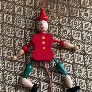 Movable wooden Pinocchio Pull puppet Jumping Jack 15 cm 6 inch Also nice as Christmas tree decoration. Original Italian with yellow buttons. Vintage