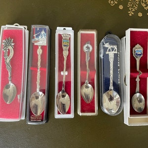 6 different souvenir teaspoons from various countries. In boxes. Vintage. Silver plated and metal - make your choice - see description in text