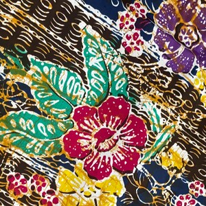 May include: A colorful batik fabric with a floral pattern. The fabric features red, pink, yellow, green, blue, and purple flowers on a brown background.