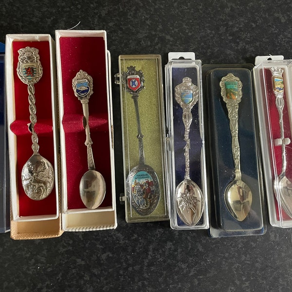 9 different souvenir teaspoons from various countries. In boxes. Vintage. Silver plated and metal - make your choice - see description in text