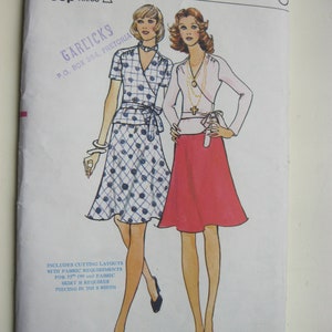May include: A vintage sewing pattern for a wrap skirt and blouse. The pattern is for size 10, bust 32 1/2 inches. The pattern is from Vogue Patterns and includes cutting layouts with fabric requirements for 35 inches of fabric. The skirt requires piecing in the width.