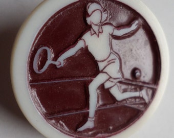 Vintage plastic Button stamped  Artid made in England -  Tennis player on brown background - 1" dia