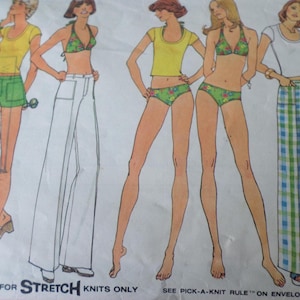 May include: An illustration of women's clothing patterns. The designs include shorts, pants, and swimwear. The text on the pattern reads "TOP SIZED FOR STRETCH KNITS ONLY" and "SEE PICK-A-KNIT RULE ON ENVELOPE BACK". The bust size is 92 cm.