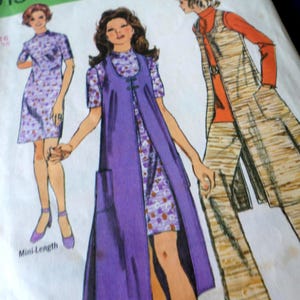 May include: Vintage sewing pattern showing three women's outfits. The designs include a mini-length floral dress, a long purple vest over a matching dress, and a long patterned coat with trousers. The pattern is from the 1970s.