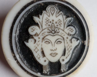 Vintage plastic Artid button - Oriental woman head - black background  1.1/4" dia - made in England