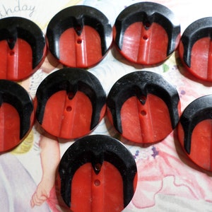 9 vintage 1930's red black layered casein  plastic buttons  1.1/8" dia