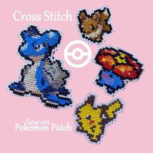 May include: Four cross-stitch Pokemon patches on a pink background. The patches feature a blue and white Lapras, a brown Eevee, a red and blue Charizard, and a yellow Pikachu. The text "Cross Stitch" and "Sew-on Pokemon Patch" are also visible.