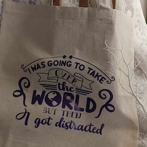 Cotton Tote Bag.  I was going to take over the world but then I got distracted.  Purple vinyl lettering on cotton.