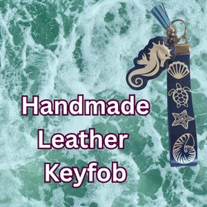 Beautiful handmade leather key fob with a nautical feel.  Featuring a wrist strap, seahorse decoration, leather tassel and metal ring.