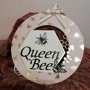 Queen Bee decorative wall hanging.  Matching items available
