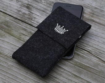 May include: A black felt phone case with a rhinestone crown design. The case is shown with a smartphone inside.