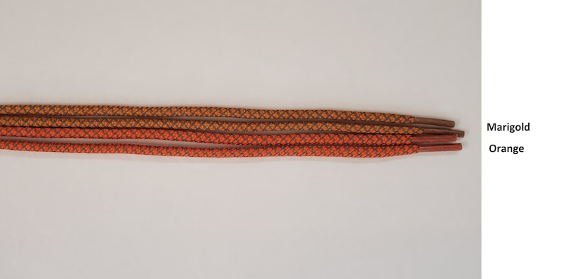 Puede incluir: Cuatro cordones para zapatos, dos naranjas y dos color marigold, con un patr&oacute;n tejido.