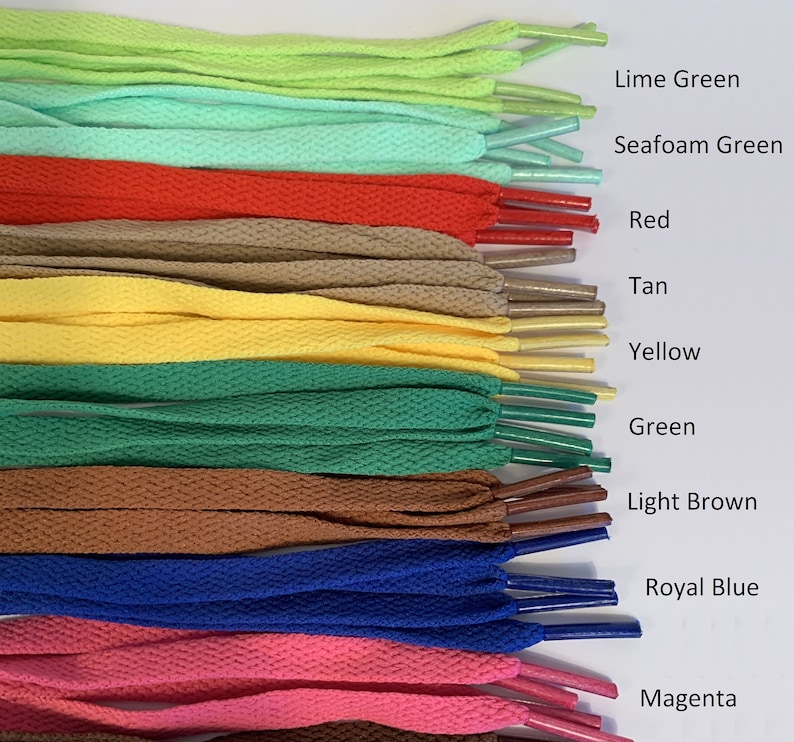 May include: A collection of shoelaces in various colors, including lime green, seafoam green, red, tan, yellow, green, light brown, royal blue, and magenta.