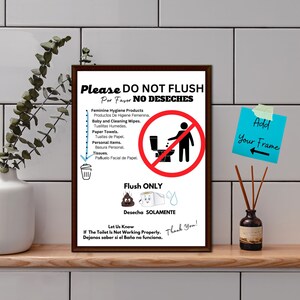 May include: A white sign with black and red text and graphics. The sign reads "Please Do Not Flush" and "Flush Only". It also includes a list of items that should not be flushed, such as feminine hygiene products, baby wipes, paper towels, and personal items. The sign is framed in a brown frame.