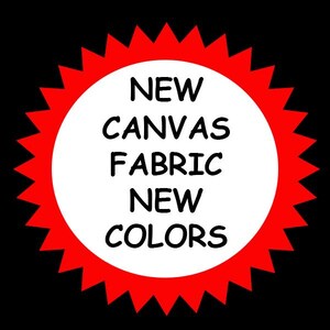 May include: A black background with a white circle in the center, surrounded by a red jagged border. The text in the circle reads "NEW CANVAS FABRIC NEW COLORS".