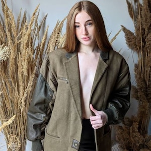 vintage 80s CLAUDE MONTANA jacket. olive wool leather bomber