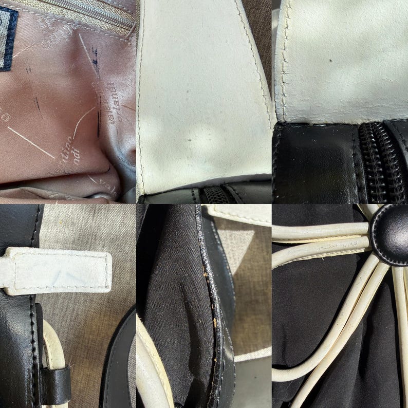 Puede incluir: Un bolso de mano en blanco y negro con un forro interior rosa claro que lleva el texto impreso Valentino Orlandi. El exterior muestra paneles en blanco y negro, cremalleras negras y detalles de cord&oacute;n blanco con un bot&oacute;n central negro.