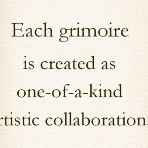 May include: Text on a cream-colored background reads: "Each grimoire is created as one-of-a-kind artistic collaboration." The text is in a serif font, centered on the page. The paper has a slightly textured appearance.