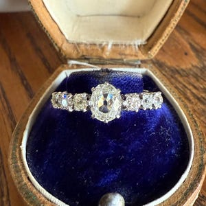 Antique Edwardian Art Deco 1.3 Carat Seven Stone Old Mine Cut Diamond Band Eye Clean Oval Center 18k Gold Platinum Prongs Tall Stacker
