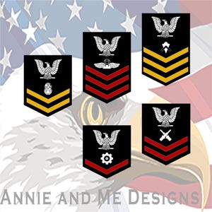 May include: Five black rectangular patches with pointed bottoms, each featuring a white eagle emblem at the top. The patches display various military-style insignia including chevrons in red or gold, a diving helmet, wings, and crossed tools.
