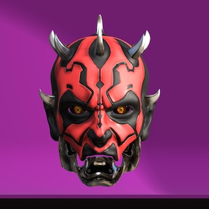 May include: A detailed mask featuring a red and black design, with silver horns and a metallic lower face. The mask has yellow eyes and is set against a purple background.