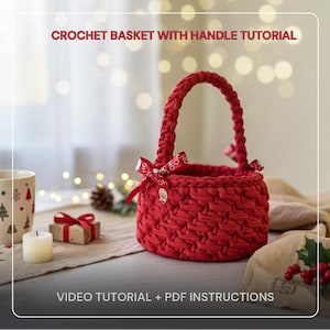 May include: A red crochet basket with a handle and a decorative bow. The basket is round and has a textured appearance. The image includes the text "CROCHET BASKET WITH HANDLE TUTORIAL" and "VIDEO TUTORIAL + PDF INSTRUCTIONS".