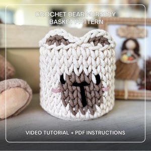 May include: A handmade crochet bear-shaped nursery basket in cream, brown, and black. The basket features a bear face design with a T-shaped nose and pink accents. The text "CROCHET BEAR NURSERY BASKET PATTERN" and "VIDEO TUTORIAL + PDF INSTRUCTIONS" are visible.