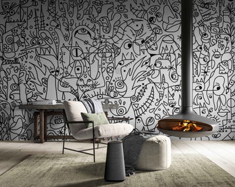 Puede incluir: Un salón moderno con un mural abstracto en blanco y negro. Una chimenea suspendida con fuego encendido es el punto central. La habitación incluye una silla, un otomán, una alfombra y un altavoz oscuro.