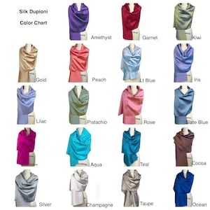 May include: A Silk Dupioni color chart featuring twenty swatches of fabric draped over mannequin forms. Each swatch is labeled with its corresponding color name, including Amethyst, Garnet, Kiwi, Gold, Peach, Lt Blue, Iris, Lilac, Pistachio, Rose, Slate Blue, Fuchsia, Aqua, Teal, Cocoa, Silver, Champagne, Taupe, and Ocean.