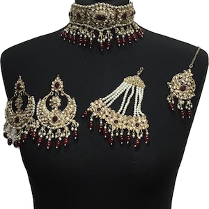 Gold maroon Pakistani bridal choker jewellery set including elegant Asian engagement bride choker, indian wedding tikka and earrings