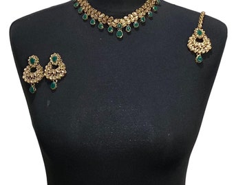 Gold green coloured Pakistani bridal necklace jewellery set including elegant Asian engagement necklace, indian wedding tikka and earrings