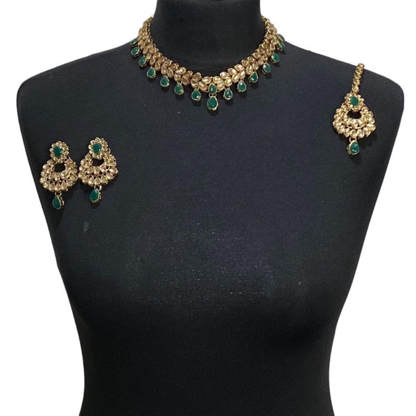 Gold green coloured Pakistani bridal necklace jewellery set including elegant Asian engagement necklace, indian wedding tikka and earrings