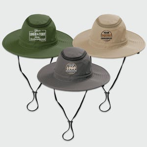 May include: Three sun hats in olive green, tan, and gray, each with a wide brim and a mesh crown. The hats have adjustable chin straps and embroidered logos. The olive green hat has the text "Your Logo & Text here Embroidered".