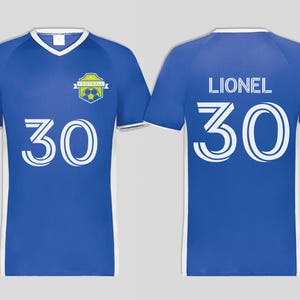 May include: A blue soccer jersey with white trim and a V-neck collar. The number "30" is prominently displayed on the front and back. The back of the jersey also features the name "LIONEL". A team logo is on the front.